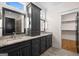 This bathroom features double vanities, granite counters, and a walk-in shower at 1278 Heritage Dr, Villa Rica, GA 30180