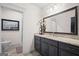 Stylish bathroom boasts granite counters, grey cabinets, and decorative accents at 1278 Heritage Dr, Villa Rica, GA 30180