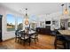 Open dining area with waterfront view, chandelier lighting, and seamless flow into the cozy living room at 1278 Heritage Dr, Villa Rica, GA 30180