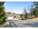 Charming two-story home featuring a manicured front yard and a two car garage at 1278 Heritage Dr, Villa Rica, GA 30180