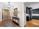 Beautiful Foyer featuring wood floors, designer lighting and a glimpse into a gourmet kitchen at 1278 Heritage Dr, Villa Rica, GA 30180
