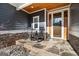 Inviting front porch with rocking chairs, stone accents, and a cozy, welcoming feel at 1278 Heritage Dr, Villa Rica, GA 30180