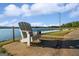 Relaxing lakeside view with an Adirondack chair and dock, perfect for enjoying the waterfront at 1278 Heritage Dr, Villa Rica, GA 30180