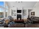 Elegant living room with a fireplace, built-in bookcases, and comfortable seating perfect for relaxation at 1278 Heritage Dr, Villa Rica, GA 30180