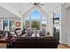 Bright living room with vaulted ceilings, large windows, fireplace, and lake views at 1278 Heritage Dr, Villa Rica, GA 30180