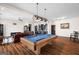 Spacious living room with pool table, hardwood flooring, and comfortable seating at 1278 Heritage Dr, Villa Rica, GA 30180