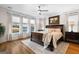 This main bedroom features a luxurious bed and stunning lake views at 1278 Heritage Dr, Villa Rica, GA 30180