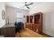 Home office with built-in bookcase, hardwood flooring, natural light, and traditional decor at 1278 Heritage Dr, Villa Rica, GA 30180