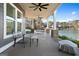 Enjoy this covered porch with ceiling fans and views of the lake at 1278 Heritage Dr, Villa Rica, GA 30180