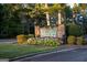 Welcome to Fairfield Plantation! Beautiful entrance sign with vibrant flowers and manicured landscaping at 1278 Heritage Dr, Villa Rica, GA 30180