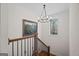 Traditional staircase with wood and iron railing, wood floors, and natural light at 1278 Heritage Dr, Villa Rica, GA 30180