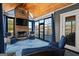Cozy sunroom with stone fireplace, lake views, and comfortable seating at 1278 Heritage Dr, Villa Rica, GA 30180