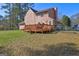 A fenced backyard shows off a wooden deck, perfect for relaxing and entertaining in the outdoor space at 110 Paces Dr, Fayetteville, GA 30215