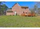Spacious backyard view featuring a wooden deck for outdoor entertainment and leisure at 110 Paces Dr, Fayetteville, GA 30215