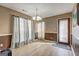 Light-filled dining room with hardwood floors, light-colored walls, and modern lighting at 110 Paces Dr, Fayetteville, GA 30215