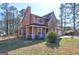 Attractive two-story home with a charming front porch and lush, green lawn at 110 Paces Dr, Fayetteville, GA 30215