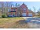 Charming two-story home featuring stone accents, a cozy porch, and an attached two-car garage at 110 Paces Dr, Fayetteville, GA 30215