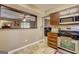 Practical kitchen with breakfast bar that offers a view into the living room at 110 Paces Dr, Fayetteville, GA 30215
