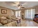 Relaxing living room featuring hard wood floors and large bright windows at 110 Paces Dr, Fayetteville, GA 30215