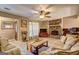Cozy living room with a stone fireplace, wood floors, and natural light at 110 Paces Dr, Fayetteville, GA 30215