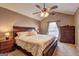 Spacious bedroom with vaulted ceilings, ceiling fan, window, and traditional furnishings at 110 Paces Dr, Fayetteville, GA 30215