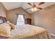 Cozy bedroom with natural light, hardwood floors, vaulted ceilings, and ceiling fan at 110 Paces Dr, Fayetteville, GA 30215