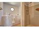 Bathroom features a walk in tub, a window, and a stand up shower at 342 Lakeshore Dr, Stockbridge, GA 30281