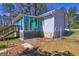 The back exterior of this home features a sunroom addition and fenced yard for outdoor enjoyment and privacy at 342 Lakeshore Dr, Stockbridge, GA 30281