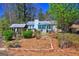 Charming single story home featuring a well-maintained lawn and covered entry at 342 Lakeshore Dr, Stockbridge, GA 30281