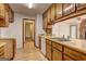 Traditional kitchen with wood cabinetry, stainless steel sink and a bright, open layout at 342 Lakeshore Dr, Stockbridge, GA 30281
