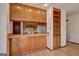 Eat in kitchen features wood cabinets and bar at 342 Lakeshore Dr, Stockbridge, GA 30281