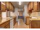 Traditional kitchen with wooden cabinets, stainless steel sink, and appliances at 342 Lakeshore Dr, Stockbridge, GA 30281
