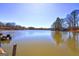 Expansive lake view showcasing serene waters, lush greenery, and a tranquil setting for relaxation and recreation at 342 Lakeshore Dr, Stockbridge, GA 30281
