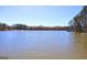 Stunning lake view featuring a tranquil expanse of water, distant shoreline, and lush trees creating scenic panorama at 342 Lakeshore Dr, Stockbridge, GA 30281