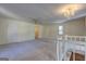 Open living area with staircase featuring natural lighting and neutral color palette at 342 Lakeshore Dr, Stockbridge, GA 30281
