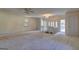 Spacious living room with staircase and multiple windows for natural light at 342 Lakeshore Dr, Stockbridge, GA 30281