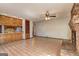 Well-lit living room featuring a brick fireplace and open access to kitchen at 342 Lakeshore Dr, Stockbridge, GA 30281