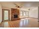 Spacious living room with brick fireplace, hardwood floors, and ample natural light at 342 Lakeshore Dr, Stockbridge, GA 30281