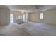 Large living room with staircase and multiple windows providing natural light at 342 Lakeshore Dr, Stockbridge, GA 30281