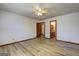 Large main bedroom with vinyl flooring, neutral walls, and en-suite bathroom at 342 Lakeshore Dr, Stockbridge, GA 30281