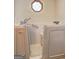 Close up view of a walk in tub that features a window above it at 342 Lakeshore Dr, Stockbridge, GA 30281