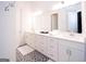 Bright bathroom with double vanity sinks, large mirror, and stylish floor tiles at 170 Fowler St # 200, Woodstock, GA 30188