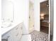 Modern bathroom with glass shower, stylish floor tiles, and bright white fixtures at 170 Fowler St # 200, Woodstock, GA 30188