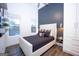 Elegant bedroom featuring a plush bed, built-in storage, and stylish decor at 170 Fowler St # 200, Woodstock, GA 30188