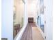 Bright hallway features modern decor, natural light, and wood-look flooring at 170 Fowler St # 200, Woodstock, GA 30188