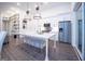 Bright, open kitchen featuring stainless steel appliances, large island with seating, and a view into the living area at 170 Fowler St # 200, Woodstock, GA 30188