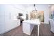 Modern kitchen featuring stainless steel appliances, a large island with bar seating, and access to the outdoor space at 170 Fowler St # 200, Woodstock, GA 30188