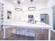 Bright, open kitchen featuring stainless steel appliances, a large island with seating, and modern pendant lighting at 170 Fowler St # 200, Woodstock, GA 30188