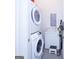 Practical laundry room with washer and dryer, storage, and modern appliances at 170 Fowler St # 200, Woodstock, GA 30188