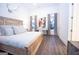 Serene main bedroom featuring wood floors, soft decor, and lots of natural light at 170 Fowler St # 200, Woodstock, GA 30188